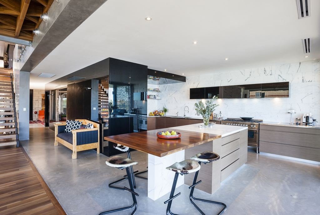 Modern kitchen with hydronic-heated polished concrete floor, marble island and timber cabinetry, East Fremantle