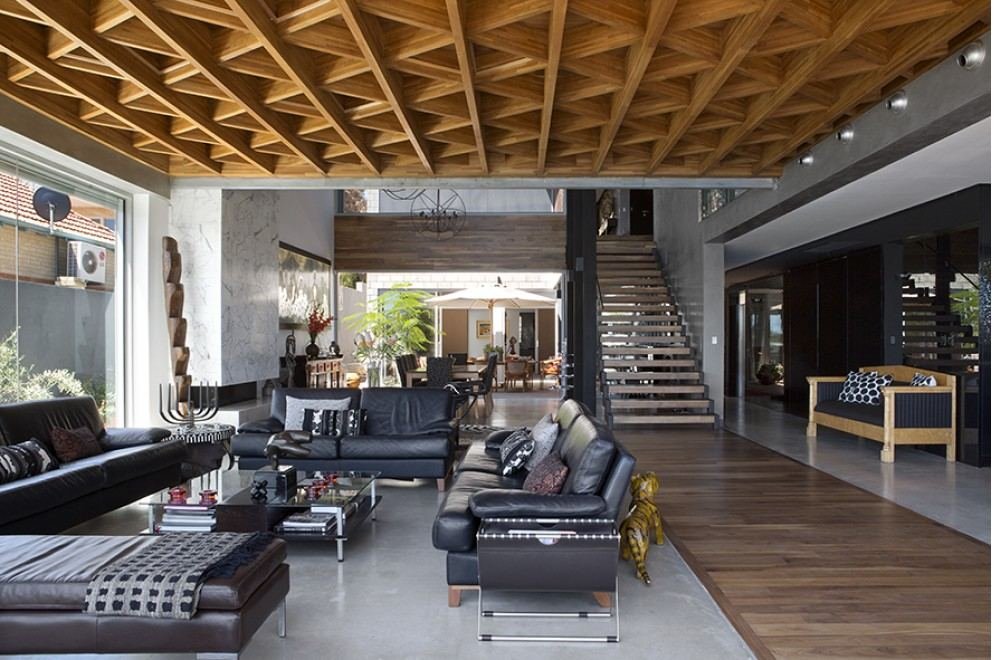 Warm open-plan living area with timber ceiling and hydronic-heated floor, East Fremantle