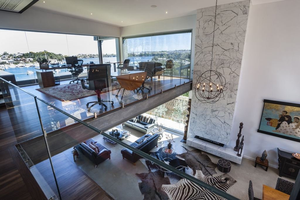 Mezzanine study overlooking an open-plan living area with marina view, hydronic-heated home, East Fremantle